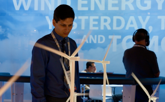 Harold Barney views an exhibit at the 2017 American Wind Energy Association Windpower conference.