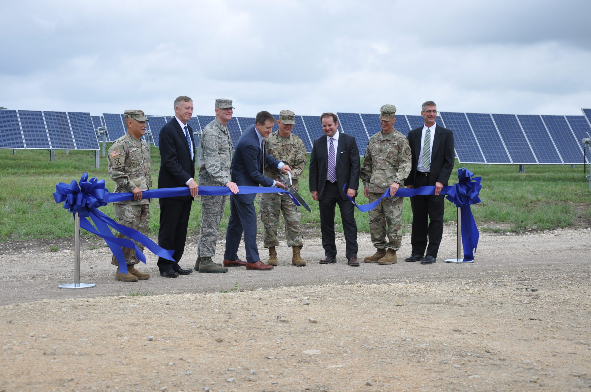 Apex CEO Mark Goodwin stands with senior military officials and civilian leaders to cut the ribbon for Phantom Solar and Cotton Plains Wind.