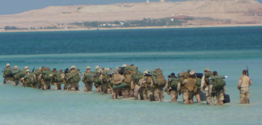 McReynolds’s unit wades through water during a military exercise in the United Arab Emirates.