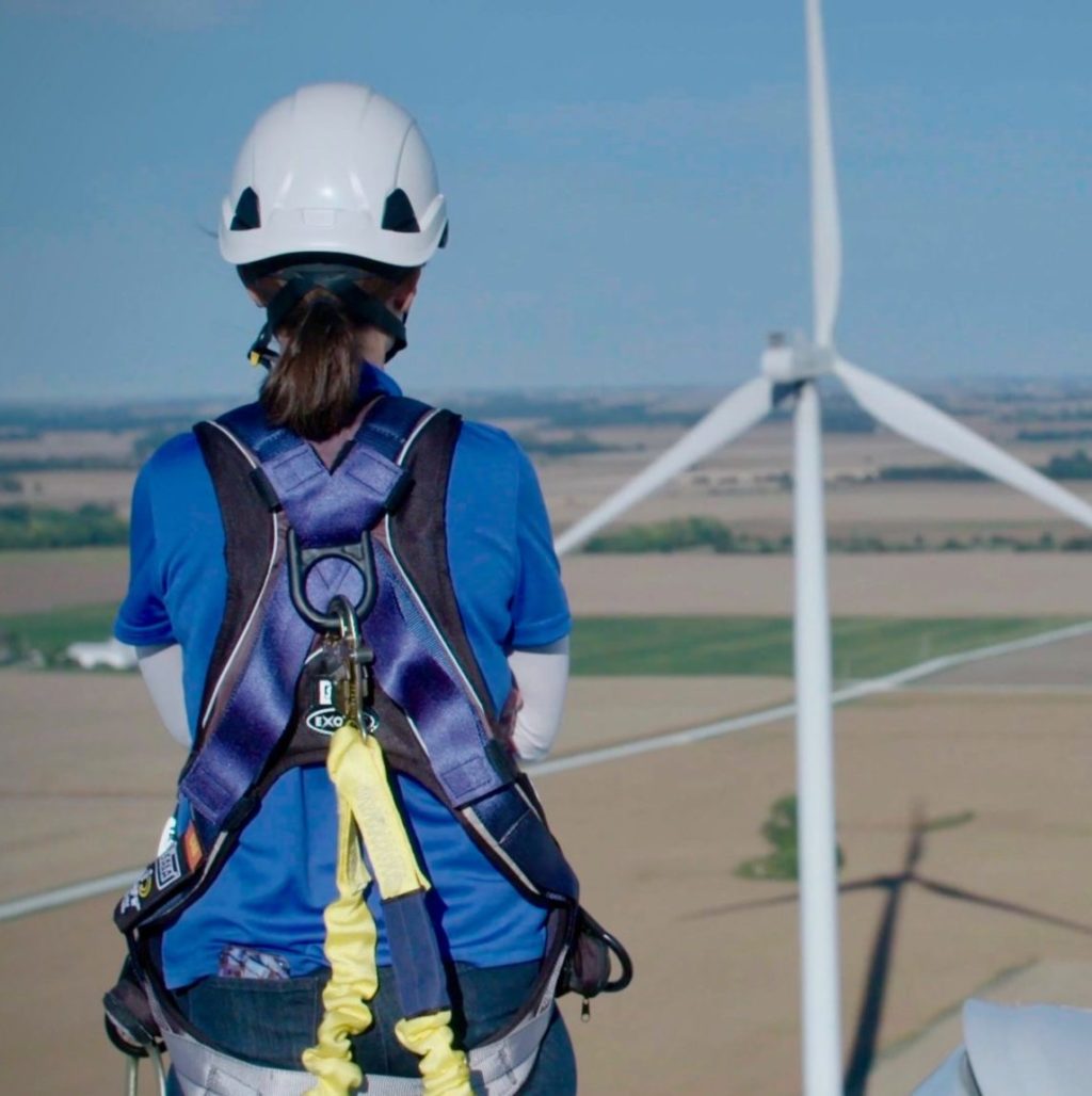 Apex Senior Development Manager Erin Baker atop a turbine in Vermilion County, Illinois.