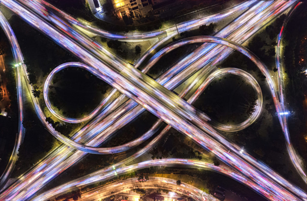 Aerial traffic blur over freeways