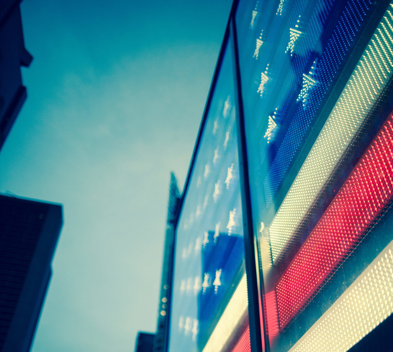 Defocused early evening with American flag in NYC