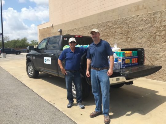 Apex employees Jack Zeckman and Patrick Curran with a delivery of supplies in Gregory, Texas.