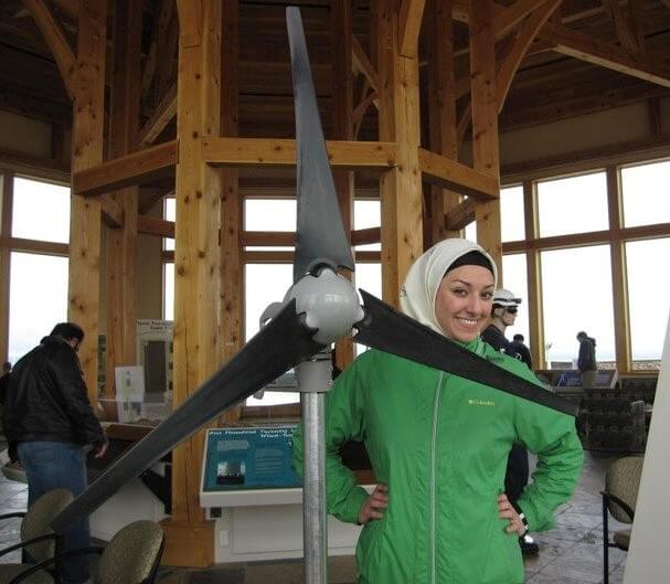 woman with model wind turbine