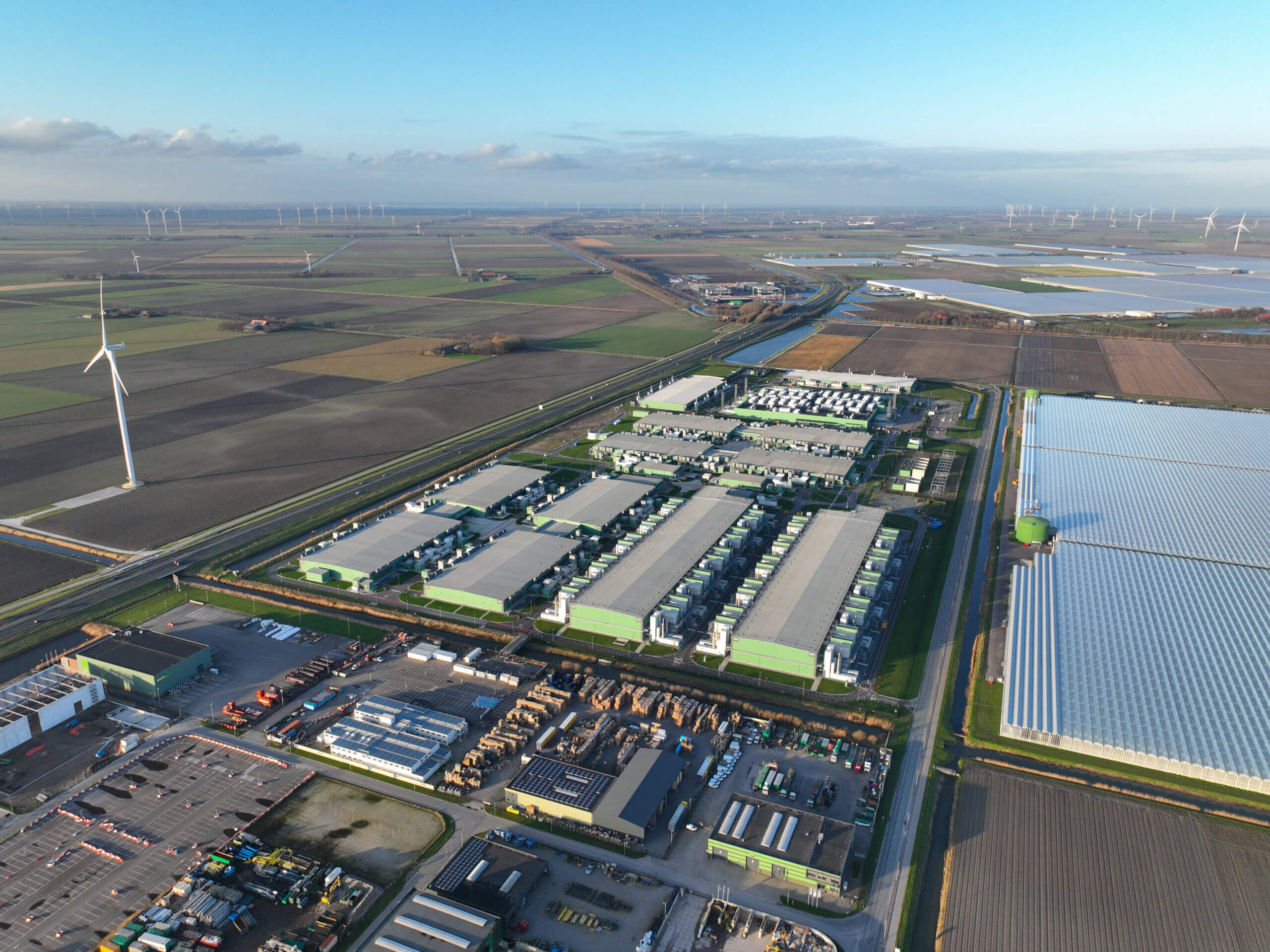 Datacenter building computing and data infrastructure. Aerial drone overhead view. Hollands kroon industrial zone. Landscape aerial.