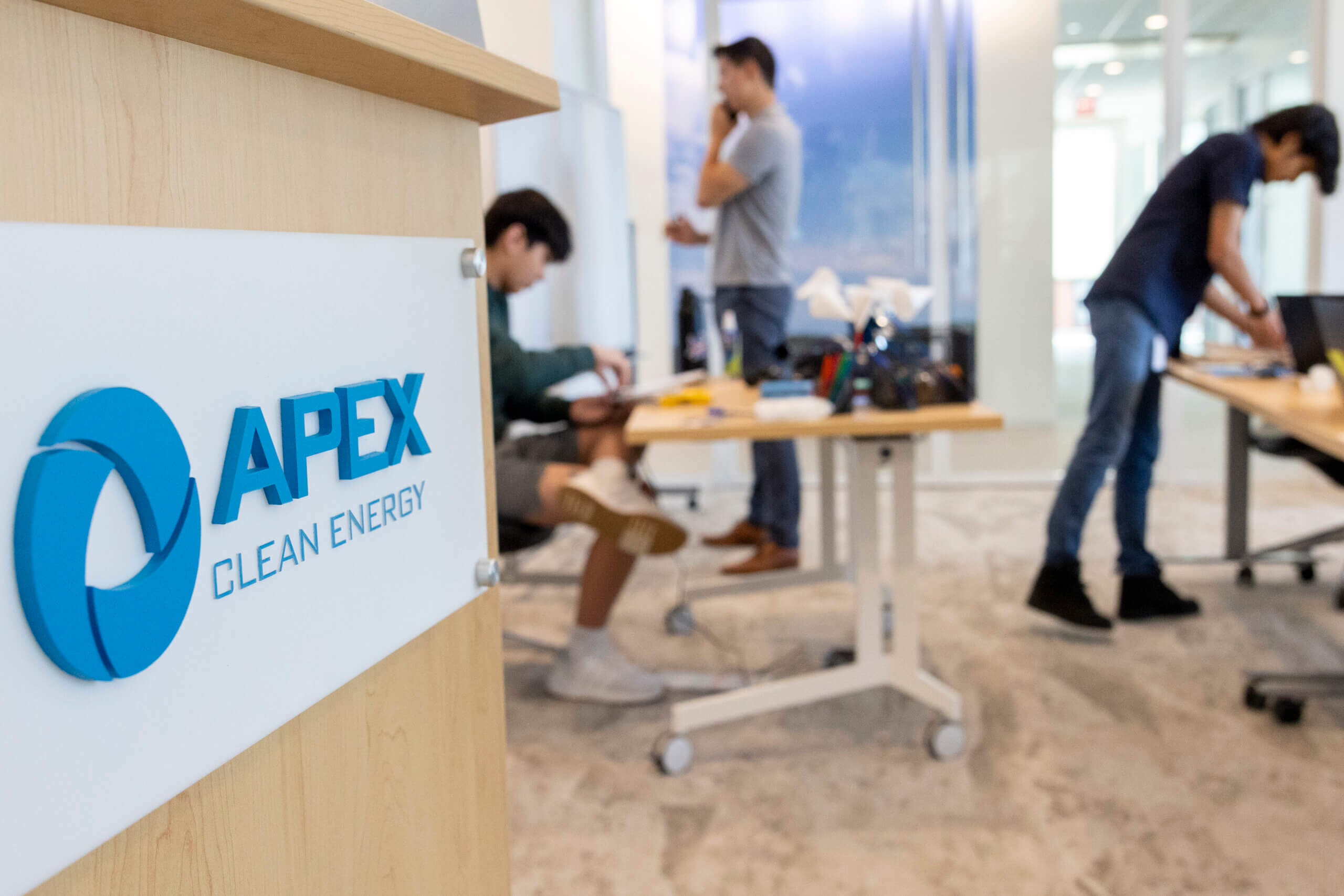 classroom with students and Apex sign in the forefront