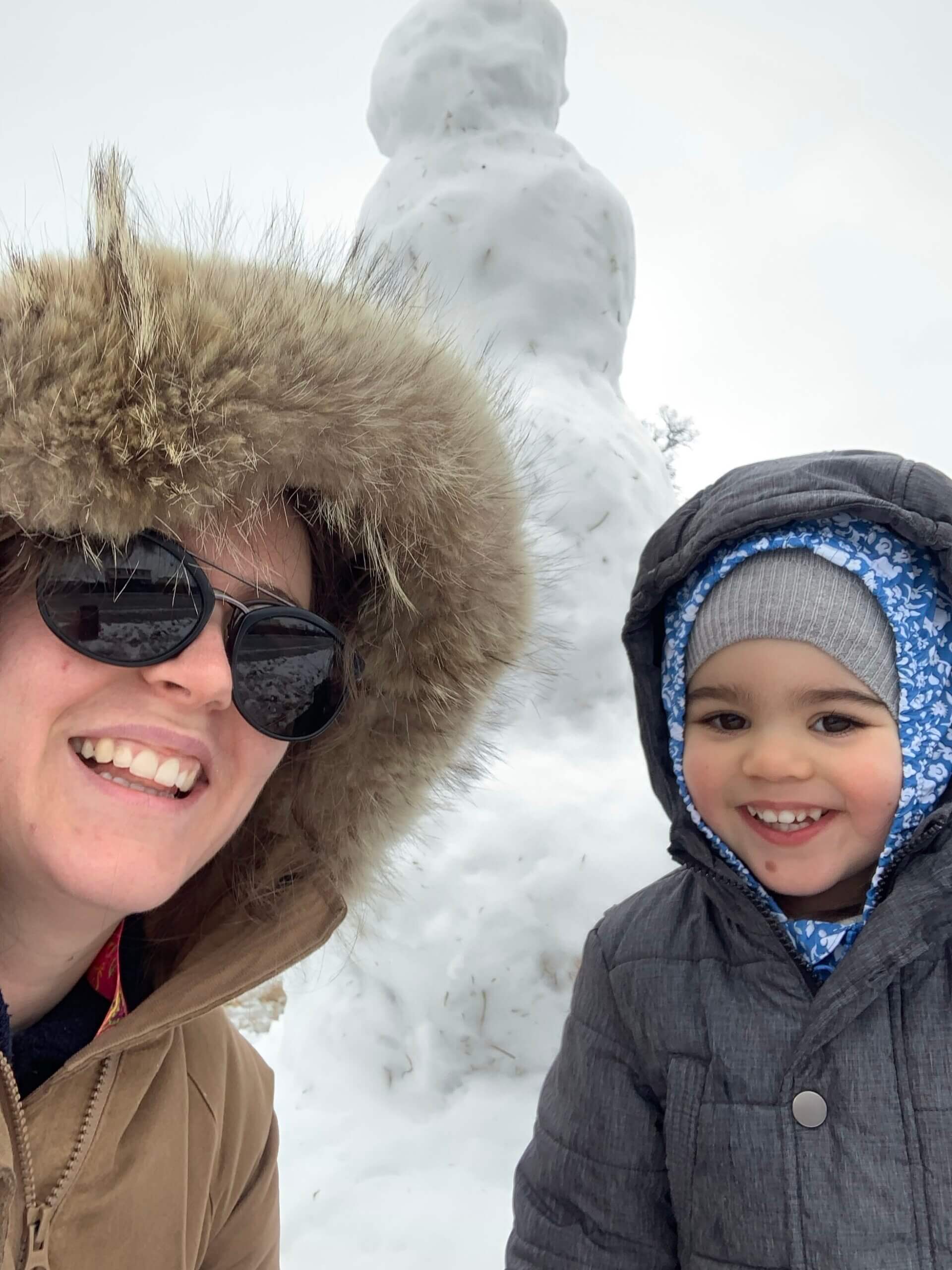 woman, girl, and snowman